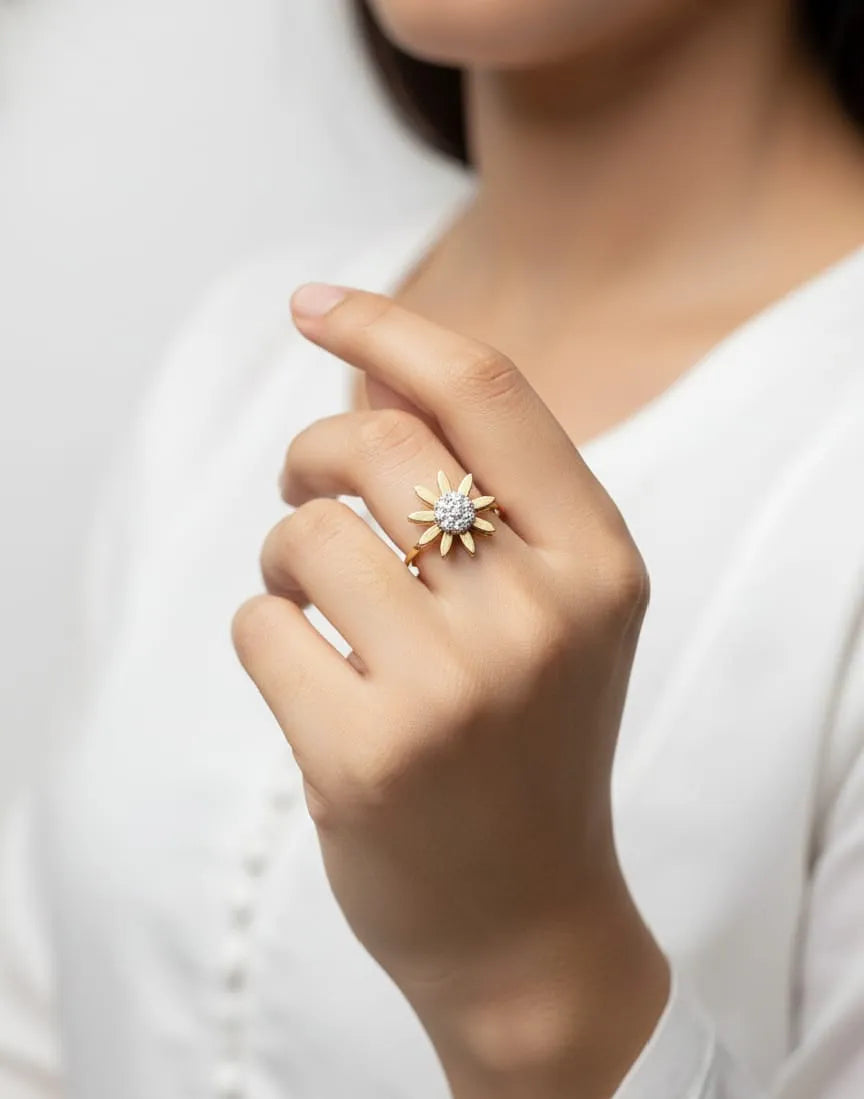 Close-up of a hand wearing a gold ring with a diamond on a white background