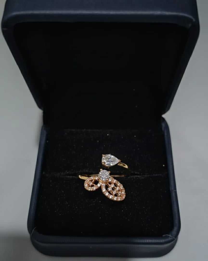 Woman wearing multiple rings with a blurred outdoor background