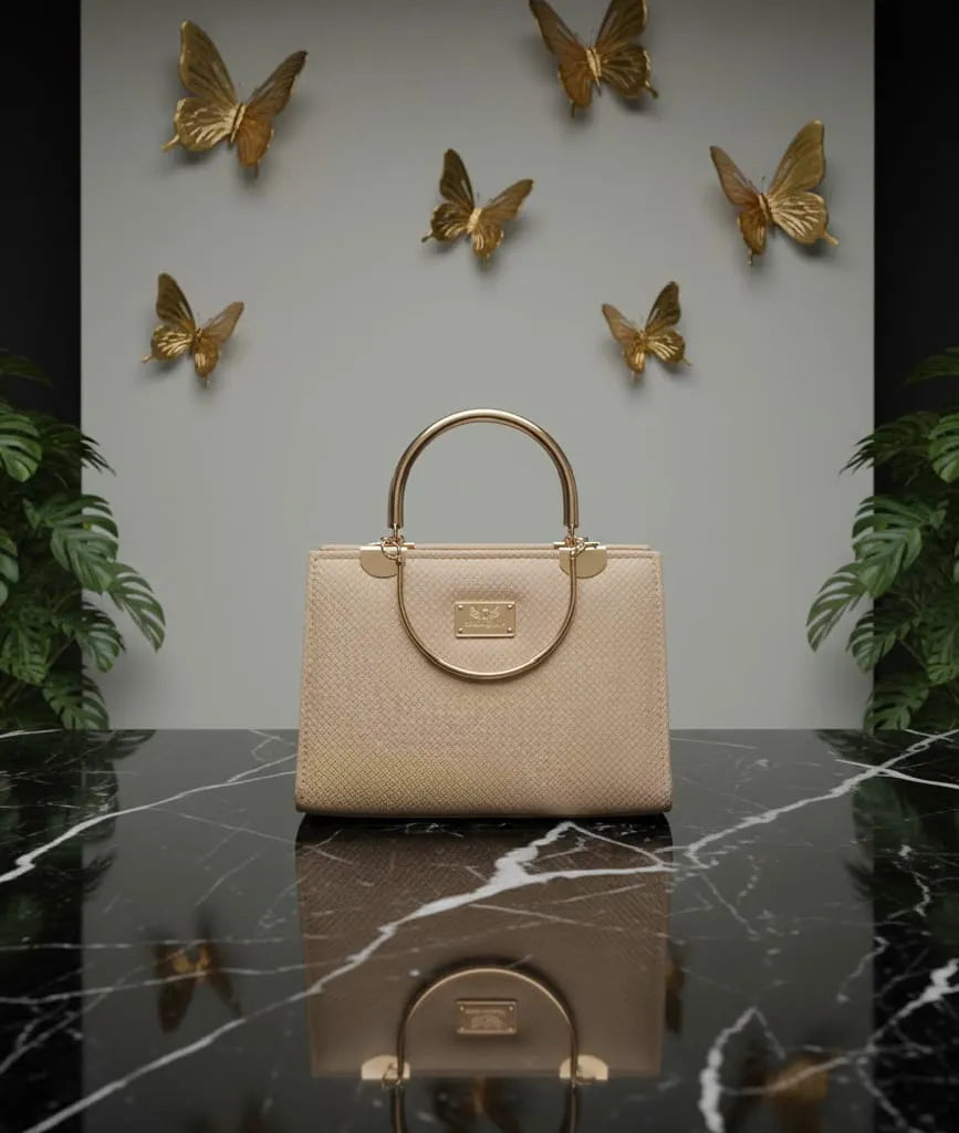 on marble table creamy bag