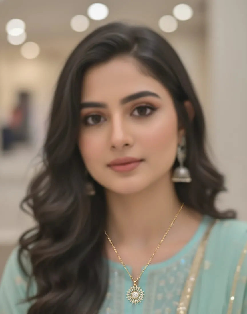 Woman wearing a light blue traditional outfit with jewelry indoors