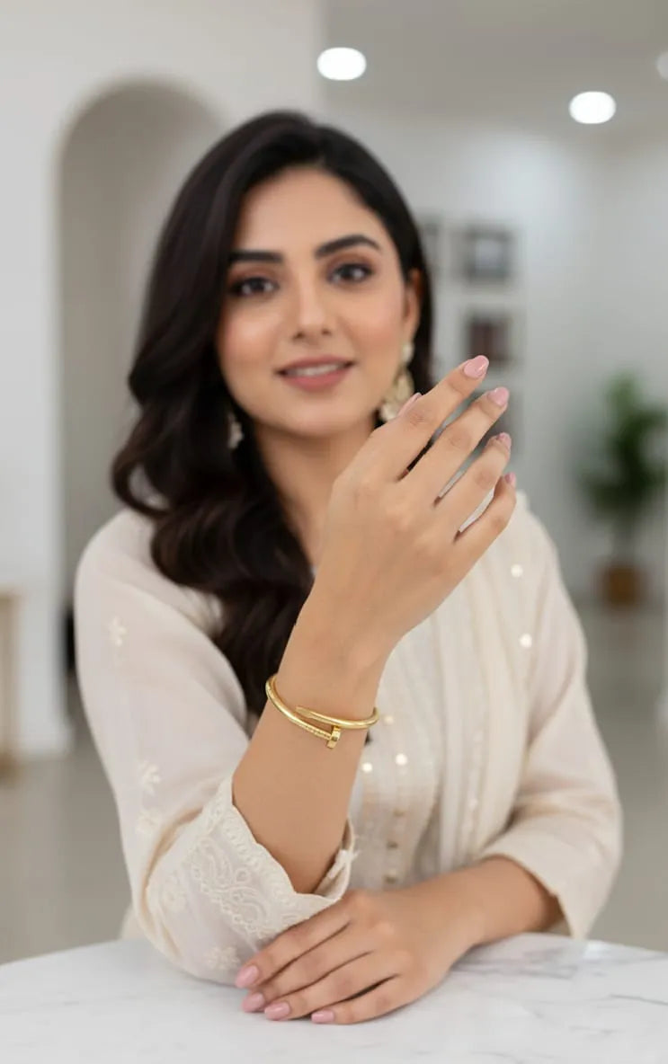 Woman holding a smartphone with a blurred indoor background