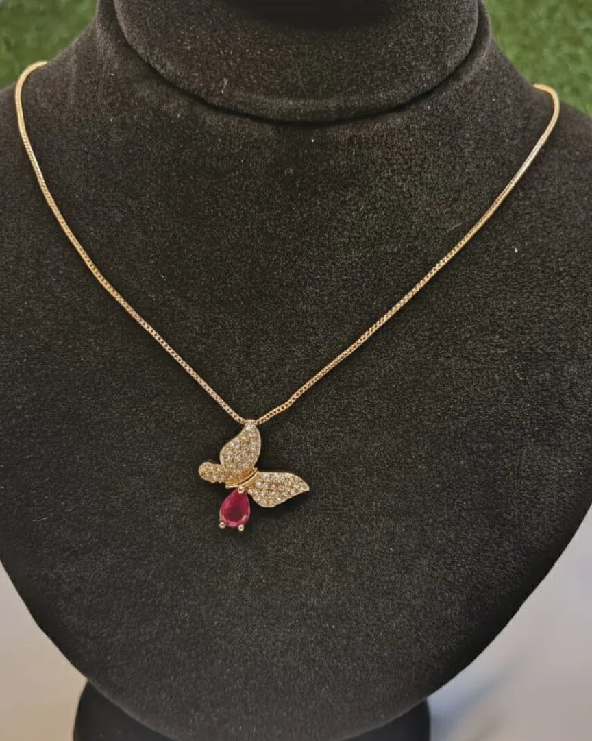 Butterfly-shaped pendant necklace on a mannequin bust