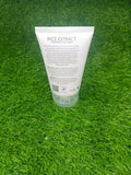Tube of rice extract cream on a green grass background