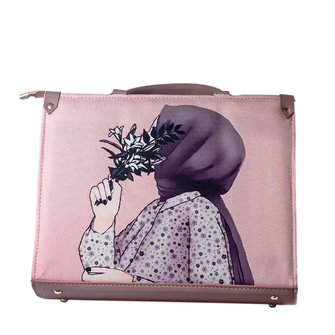 Pink suitcase with a design of a person wearing a headscarf holding flowers on a white background