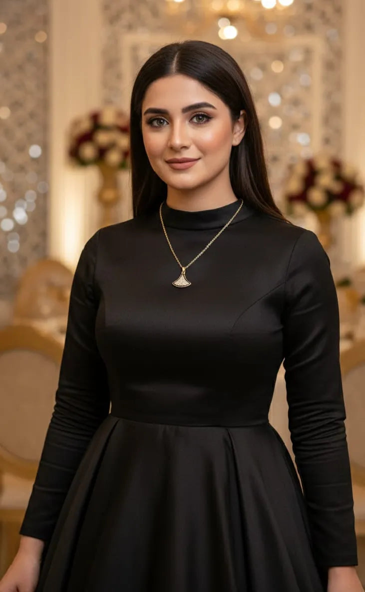 Woman wearing a black dress with a blurred decorative background